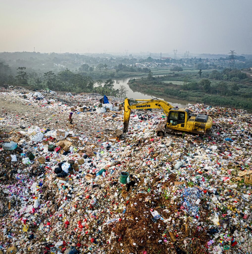 Aerial shot of a sprawling landfill in South Tangerang, Indonesia, highlighting waste and pollution challenges.